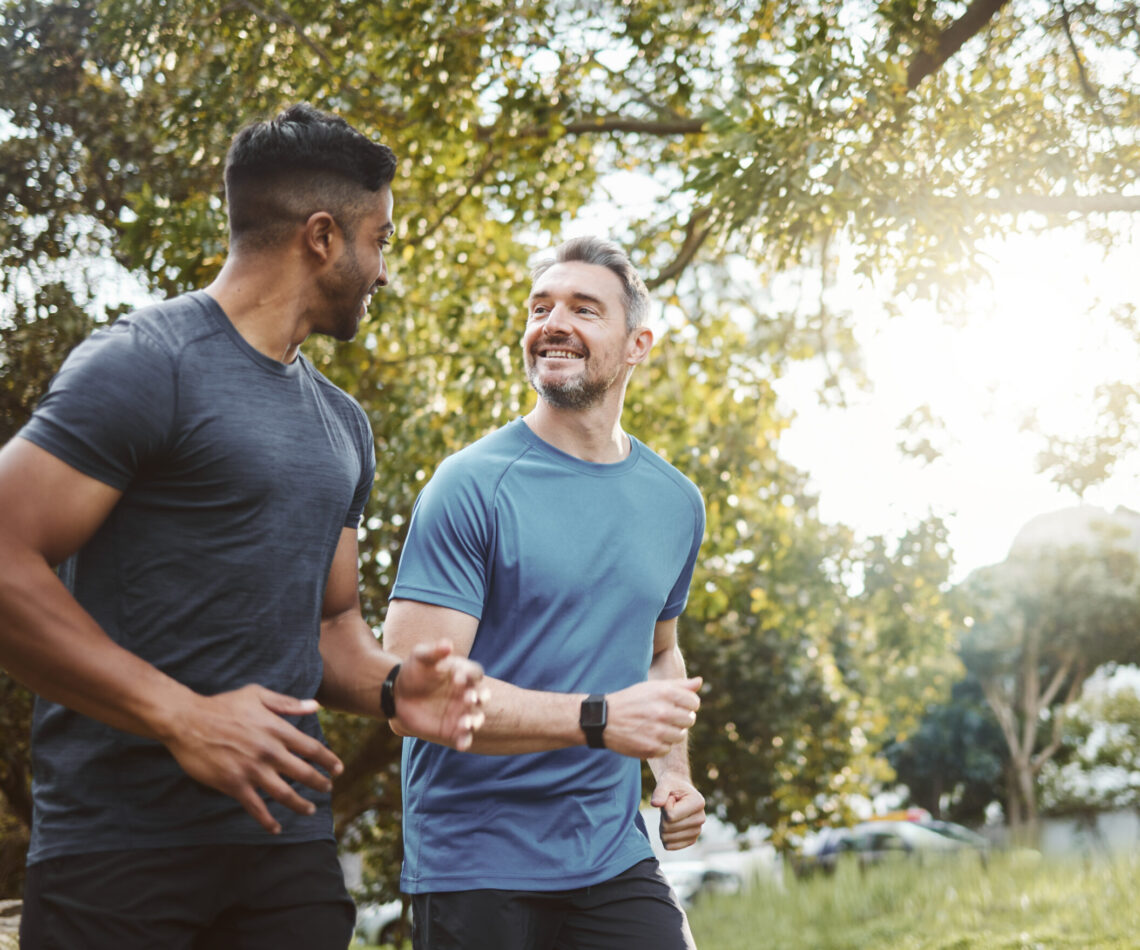 Running team, fitness and men in nature park with cardio, athlete and support for sports and health. Exercise friends, diversity and runner club, healthy and training for race outdoor with workout
