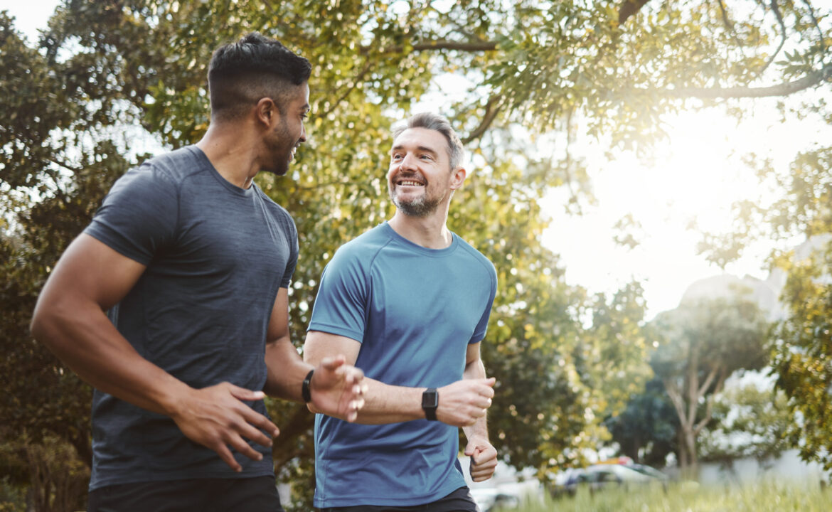Running team, fitness and men in nature park with cardio, athlete and support for sports and health. Exercise friends, diversity and runner club, healthy and training for race outdoor with workout