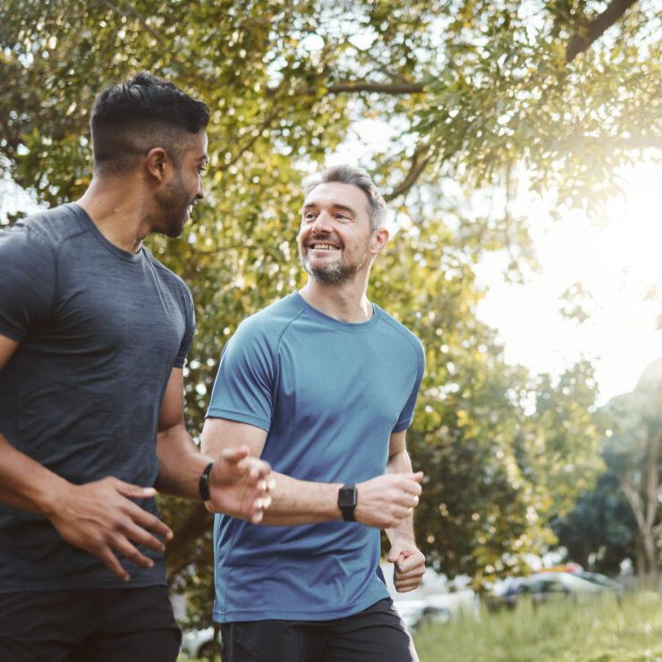 Running team, fitness and men in nature park with cardio, athlete and support for sports and health. Exercise friends, diversity and runner club, healthy and training for race outdoor with workout